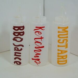 SET OF THREE CONDIMENT BOTTLES